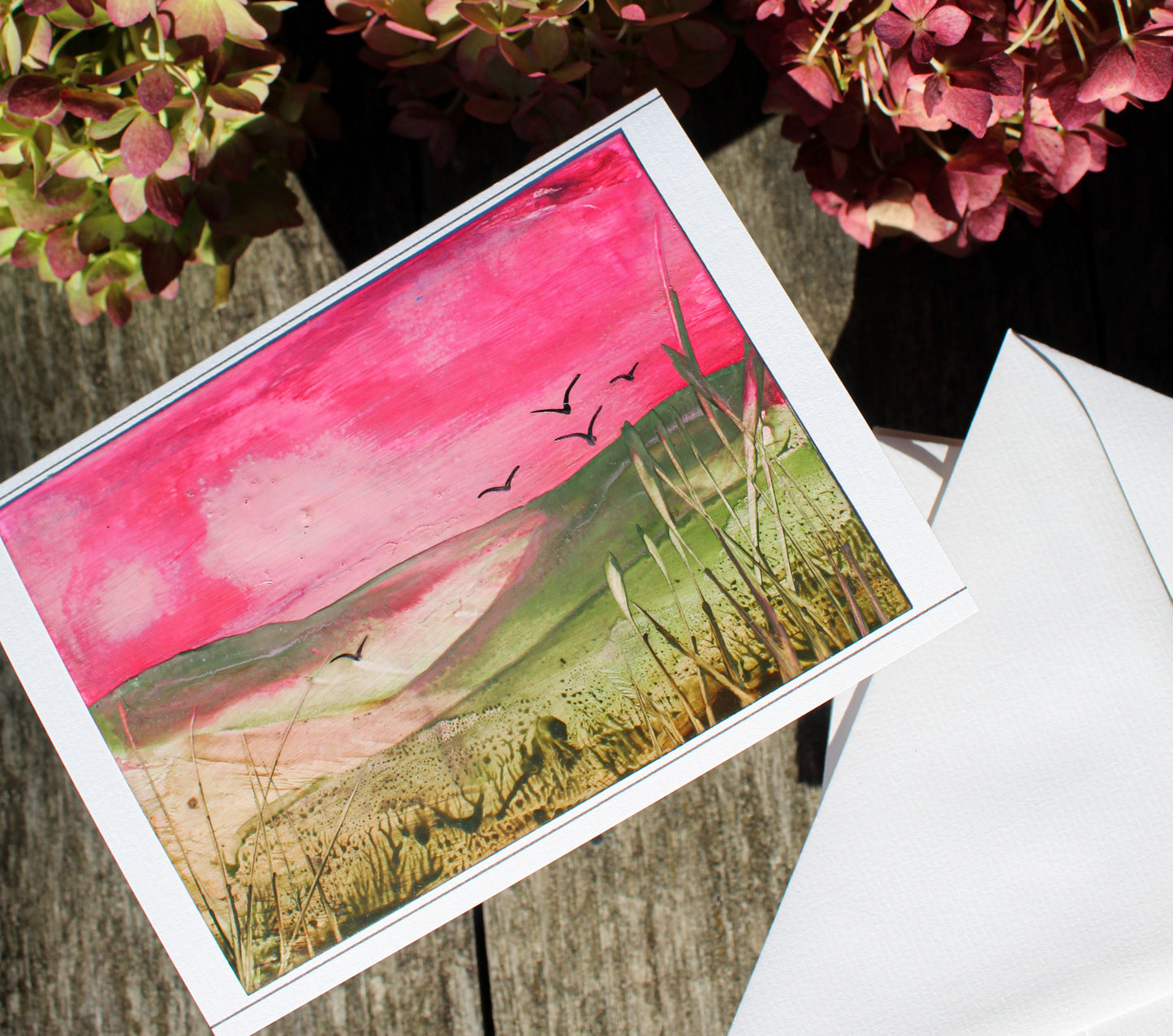 Folded Autumn greeting card. Pink sunset colours